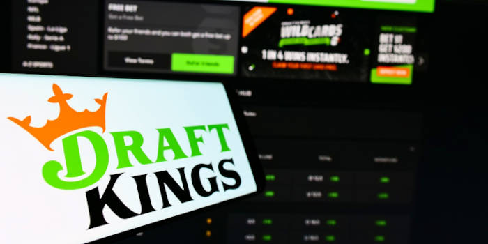 Cathie Wood’s ARK Trims DraftKings Position after Selling Over 294,000 Shares